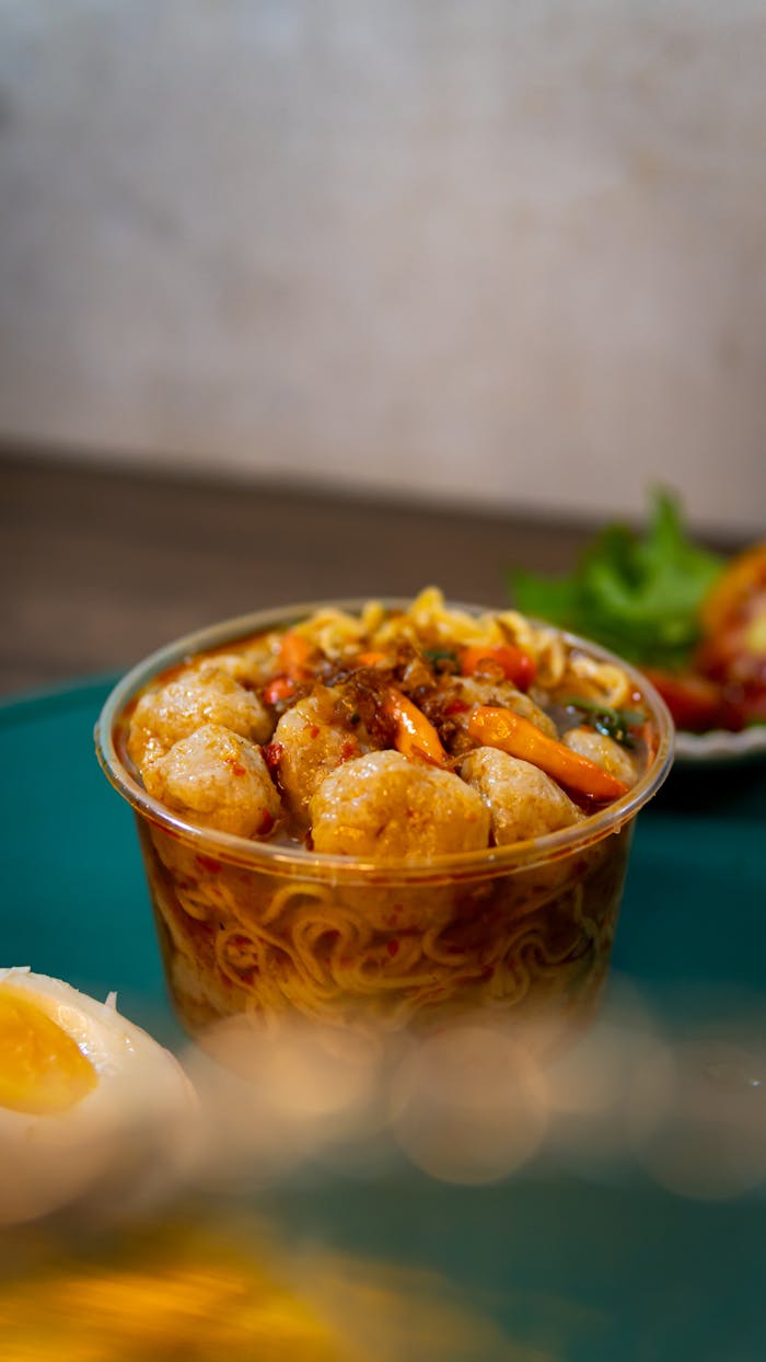 about-01 Close-up of spicy seafood noodles with prawns and egg, Jakarta style.