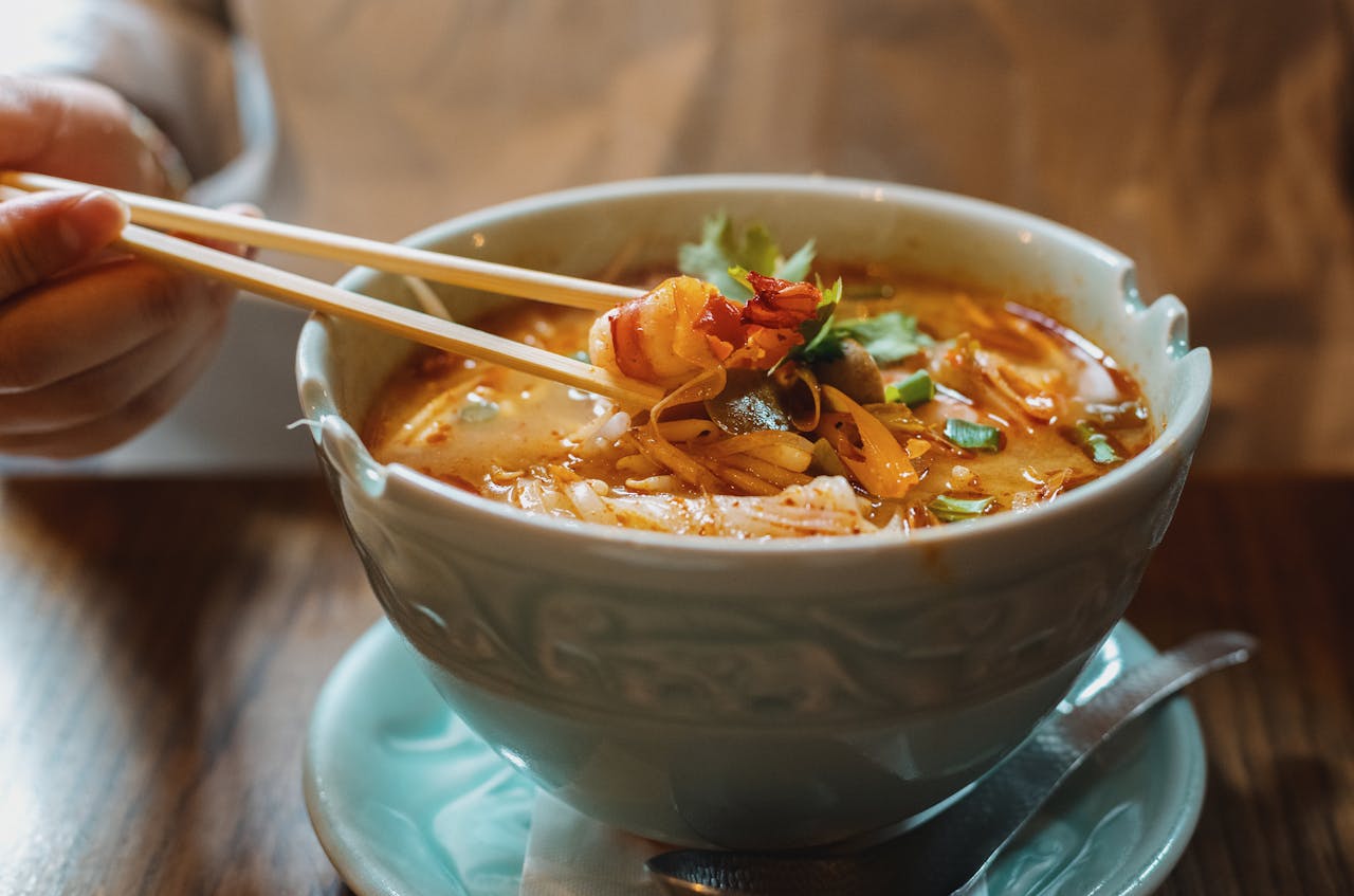 gallery-3 A flavorful bowl of seafood ramen with fresh ingredients, captured in Tokyo's vibrant dining scene.